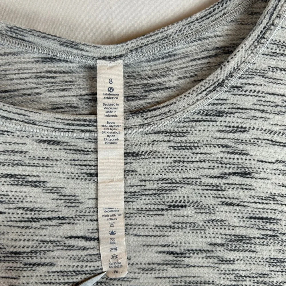 Lululemon Athletica Space Dye Relaxed Fit Short Sleeve Top Size 8 White Black